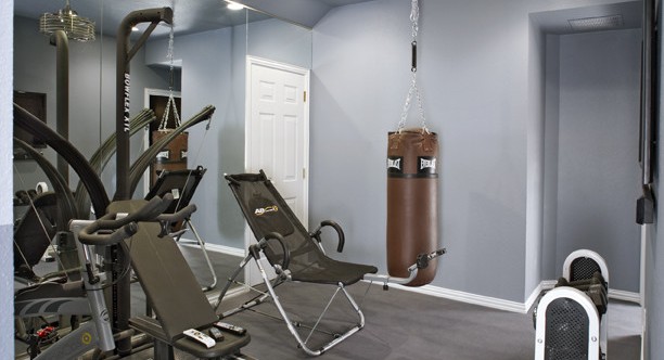 contemporary home gym in the basement